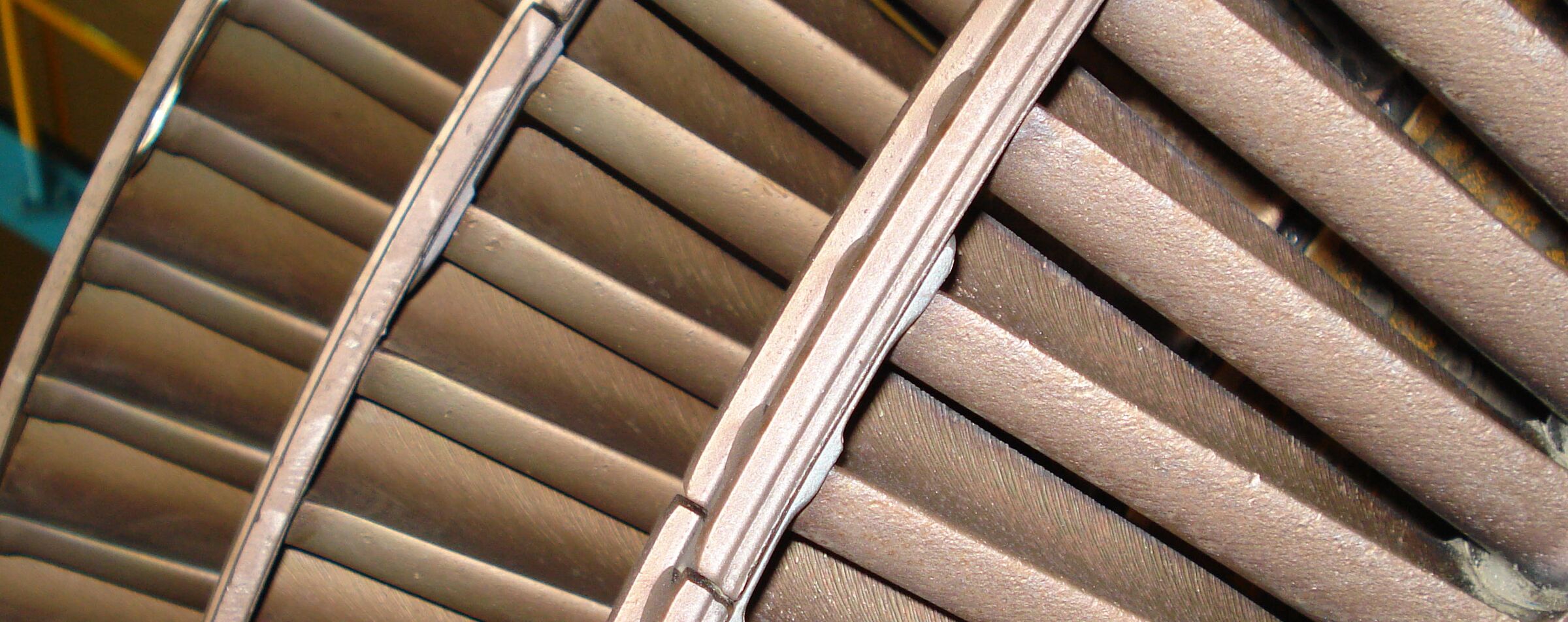 Close view of a geothermal turbine rotor with the blades cleaned back to bare metal